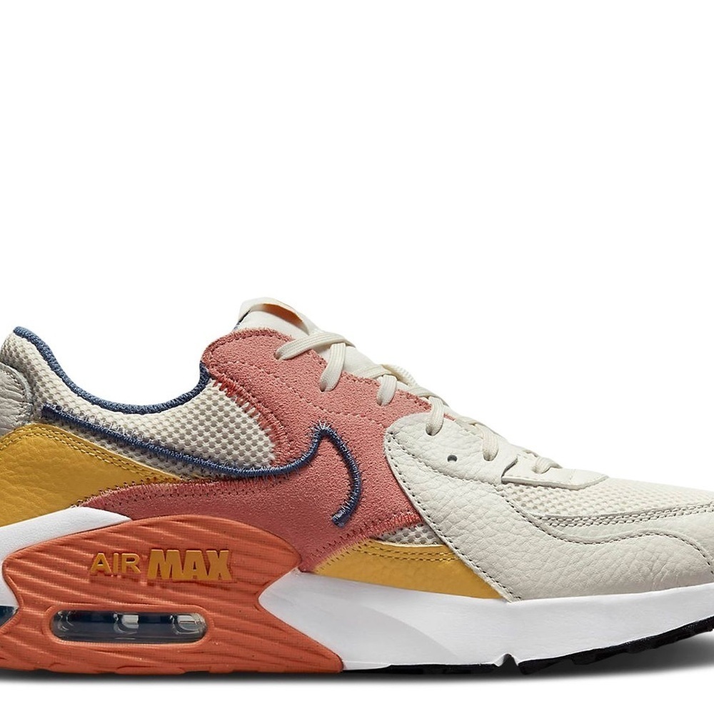 Nike Cream and Pink Athletic Shoes with Air Cushioning